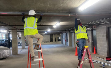 construction workers working in a parking garage